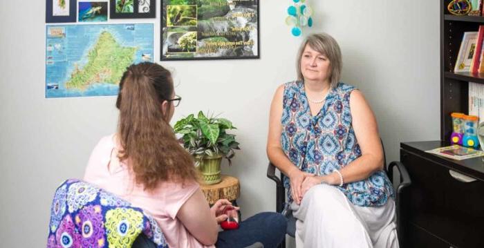 Two women sitting in counseling session.