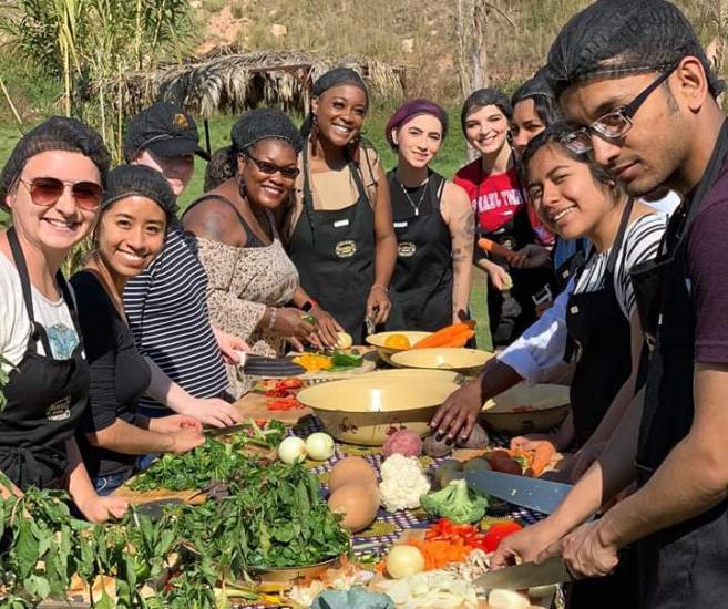 group of student cooking outside during an event.